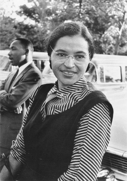 Rosa Parks in 1955 with Martin Luther King, Jr. in the background